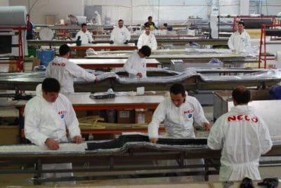 Article on shorter surfskis showing the Nelo manufacturing 